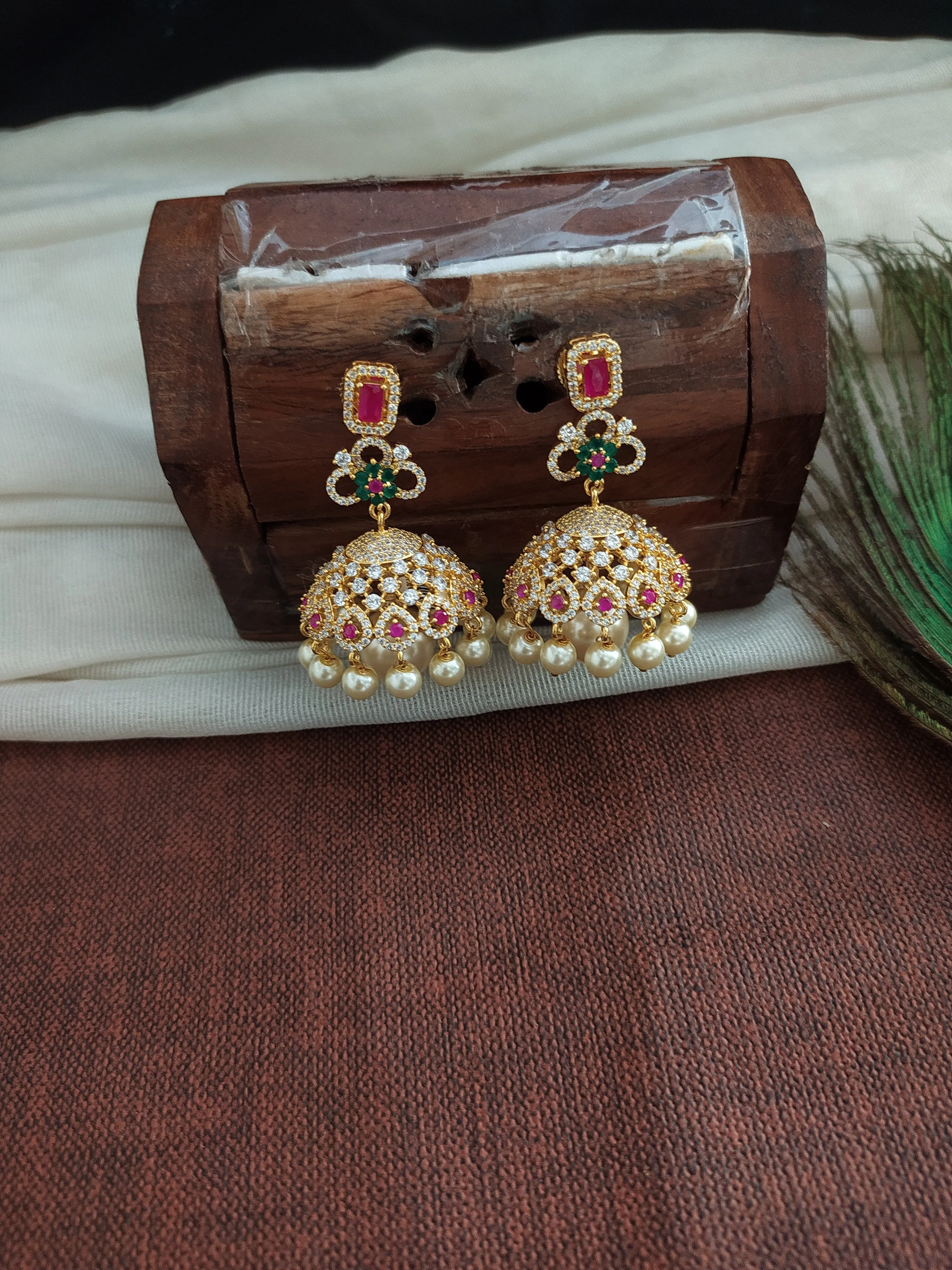 Adorable Gold Plated Jhumka With Zircon Stones